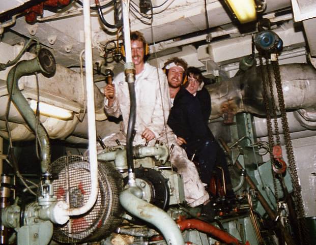 3/O(E) Nick Tucker, MM1 Lee Scully & MM?
Fort Grange 1988. ME dept in triumphant mood after reducing troublesome no.5 generator engine to its crankshaft following dreadful workmanship by DML during refit. If you want a job doing properly.....
