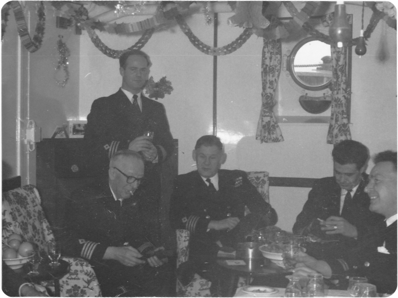 RFA Warden ~ 1962
RFA Warden,  Christmas  - probably 1962 taken by John Hargreaves (Chief Officer).  Pic includes the Chief Engineer Dicky Daw, Capt Frank Murray, standing First Officer and two engineers, names forgotten. Maybe you can tell us?
