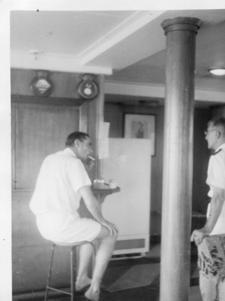 Retainer,wardroom,Singapore.63/64
Sandy Peterson a professional third engineer talking to the ship's Doctor (Dr. George Wilson on the left)
