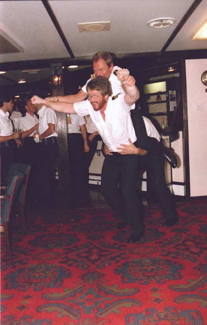 Fort Grange, (Global '86 Headache)
Horsing around. Jim Trunks, Bob Roullier, (riding), the only ship I  paid off completely broke..!! Good trip though.
