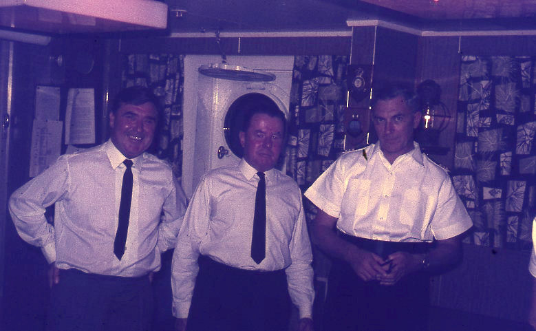 Fred Gravelle SRO
Photo also includes L - R  Signalman, Yeoman and Fred.
RFA Stromness 1970/1
